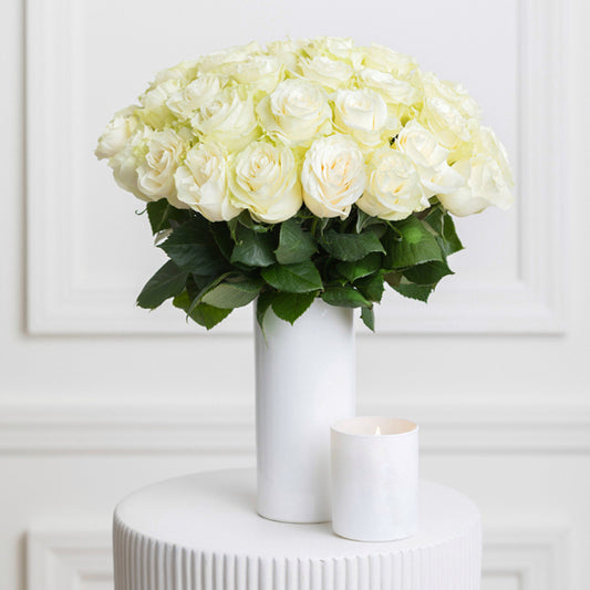 White beautiful roses in a vase